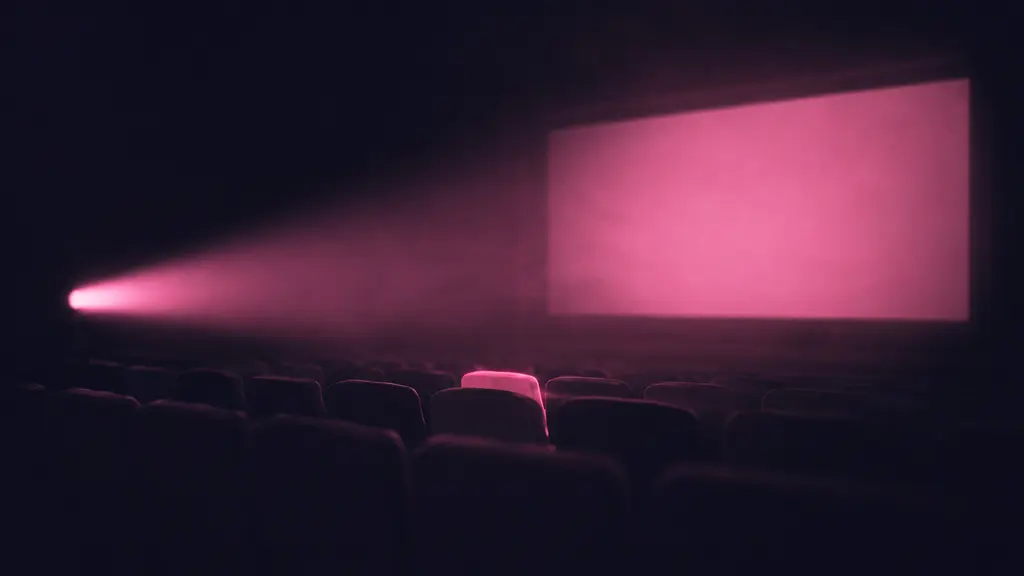 Nizami poster: a cinema hall lit by a pink projector beam